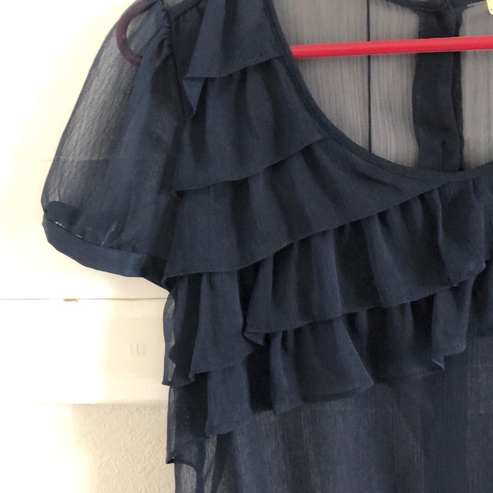 Sheer, ruffled navy blue top